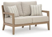 Hallow Creek Outdoor Loveseat with Cushion - US Furniture & Mattress (Waterbury,CT)*