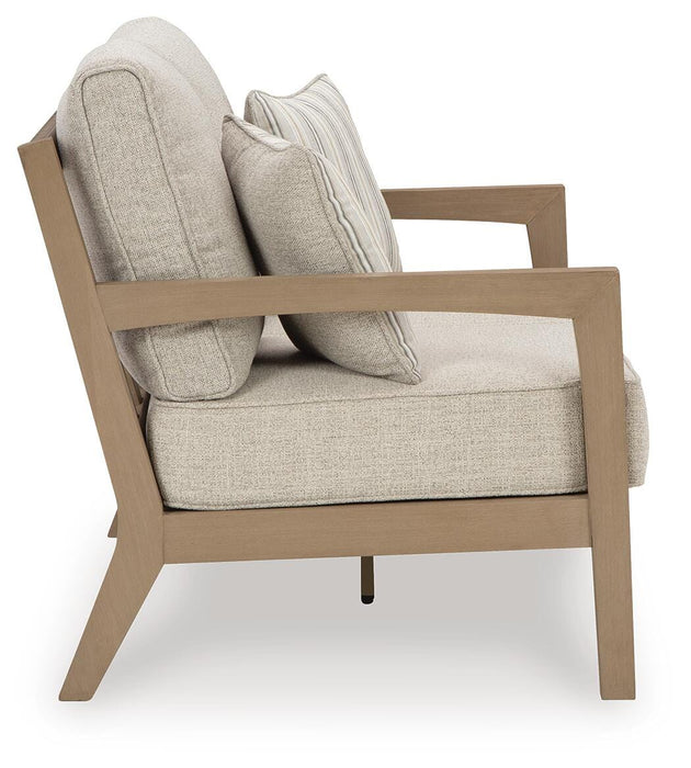 Hallow Creek Outdoor Loveseat with Cushion - US Furniture & Mattress (Waterbury,CT)*